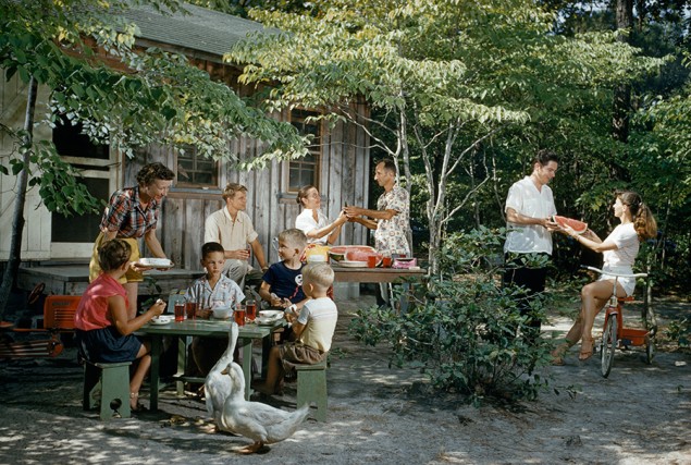 Friends eat watermelon outside a beach cottage on a summer afternoon on Roanoke Island, North Carolina, 1955. PHOTOGRAPH BY J. BAYLOR ROBERTS, NATIONAL GEOGRAPHIC