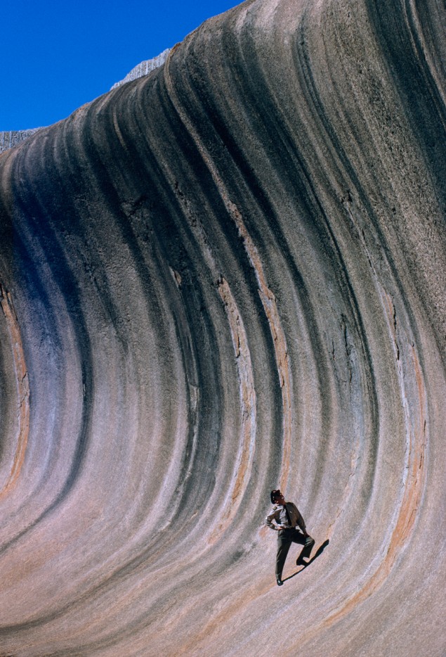 A wave of rock shaped by wind and rain towers above a plain in Western Australia, September 1963. PHOTOGRAPH BY ROBERT B. GOODMAN, NATIONAL GEOGRAPHIC