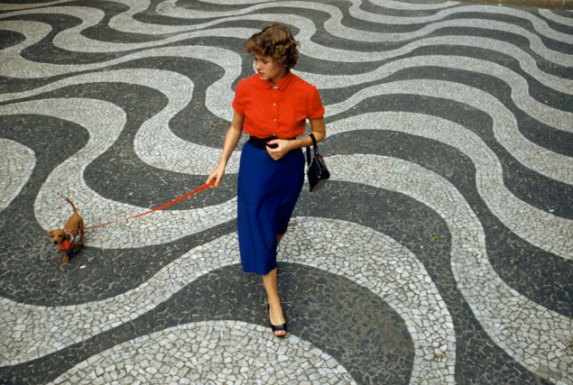 A woman walks a dachshund across pavement with undulating wave patterns in Rio de Janeiro, Brazil, March 1955. PHOTOGRAPH BY CHARLES ALLMON, NATIONAL GEOGRAPHIC