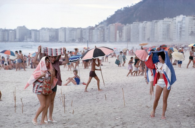 Sunbathers run for cover from a summer rain shower in Rio de Janiero, September 1962. PHOTOGRAPH BY WINFIELD PARKS, NATIONAL GEOGRAPHIC