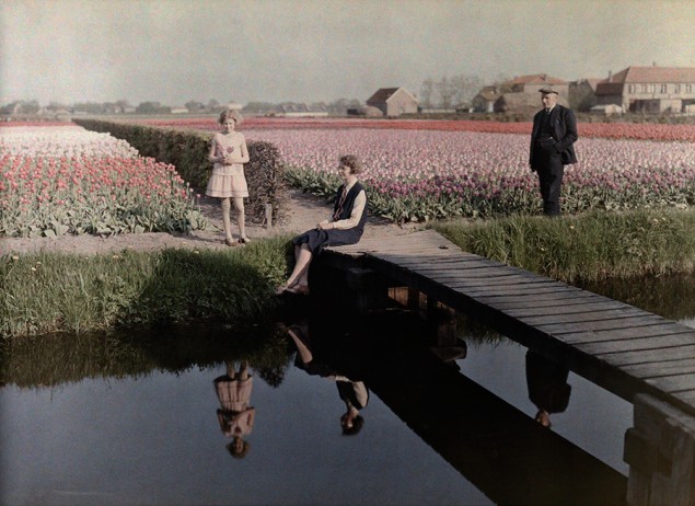 Locals relax by the tulip fields along the canal in Haarlem, The Netherlands, 1931. PHOTOGRAPH BY WILHELM TOBIEN, NATIONAL GEOGRAPHIC CREATIVE