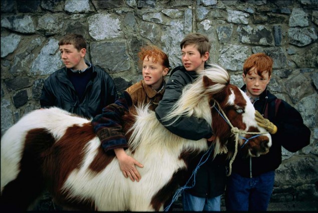 Lee Johnson (left) lets his friends handle his pony Gypsy, which he keeps in a stable behind his home in the Clondalkin district of Dublin, Ireland, April 1994. PHOTOGRAPH BY SAM ABELL, NATIONAL GEOGRAPHIC