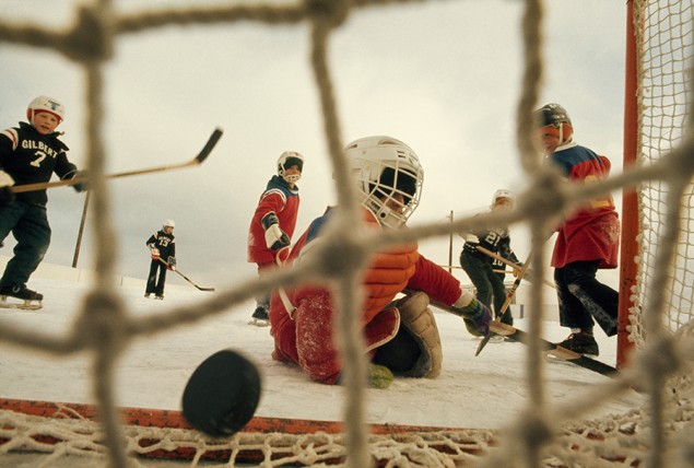 Boys play hockey when temperatures sink below freezing in Minnesota, February 1976. PHOTOGRAPH BY DAVID BOYER, NATIONAL GEOGRAPHIC