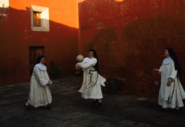 Novice nuns play ball at the Santa Catalina Monestary in Arequipa, Peru, 1998. PHOTOGRAPH BY MELISSA FARLOW, NATIONAL GEOGRAPHIC