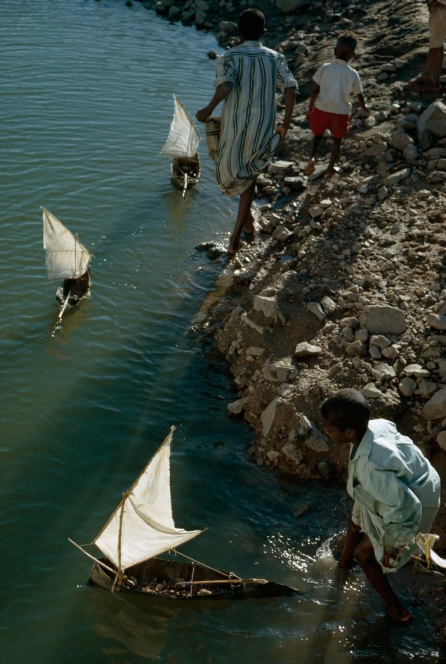Boys play with toy sailboats along the Nile south of Aswan, Egypt, October 1963. PHOTOGRAPH BY GEORG GERSTER, NATIONAL GEOGRAPHIC